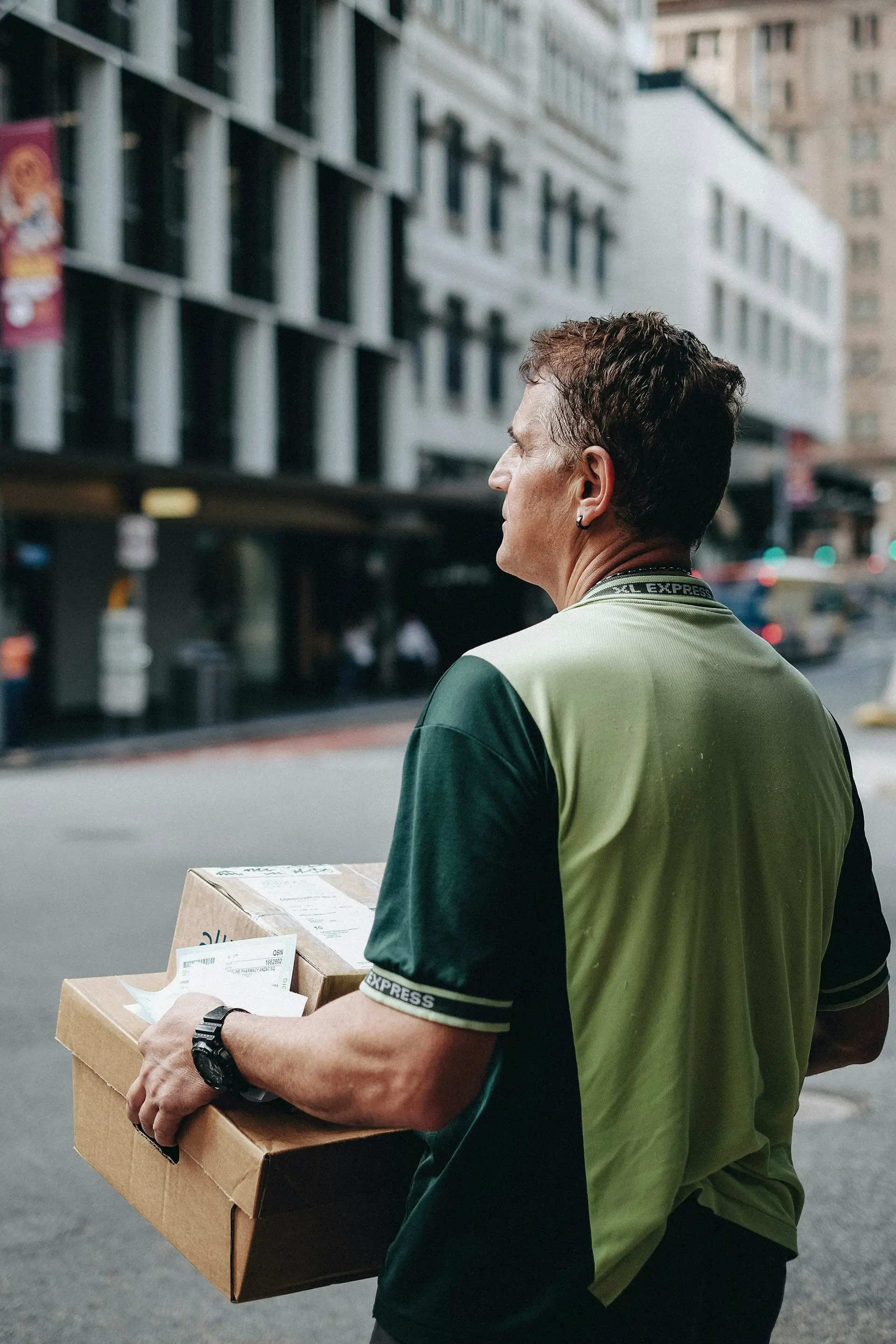 Man carrying cardboard boxes