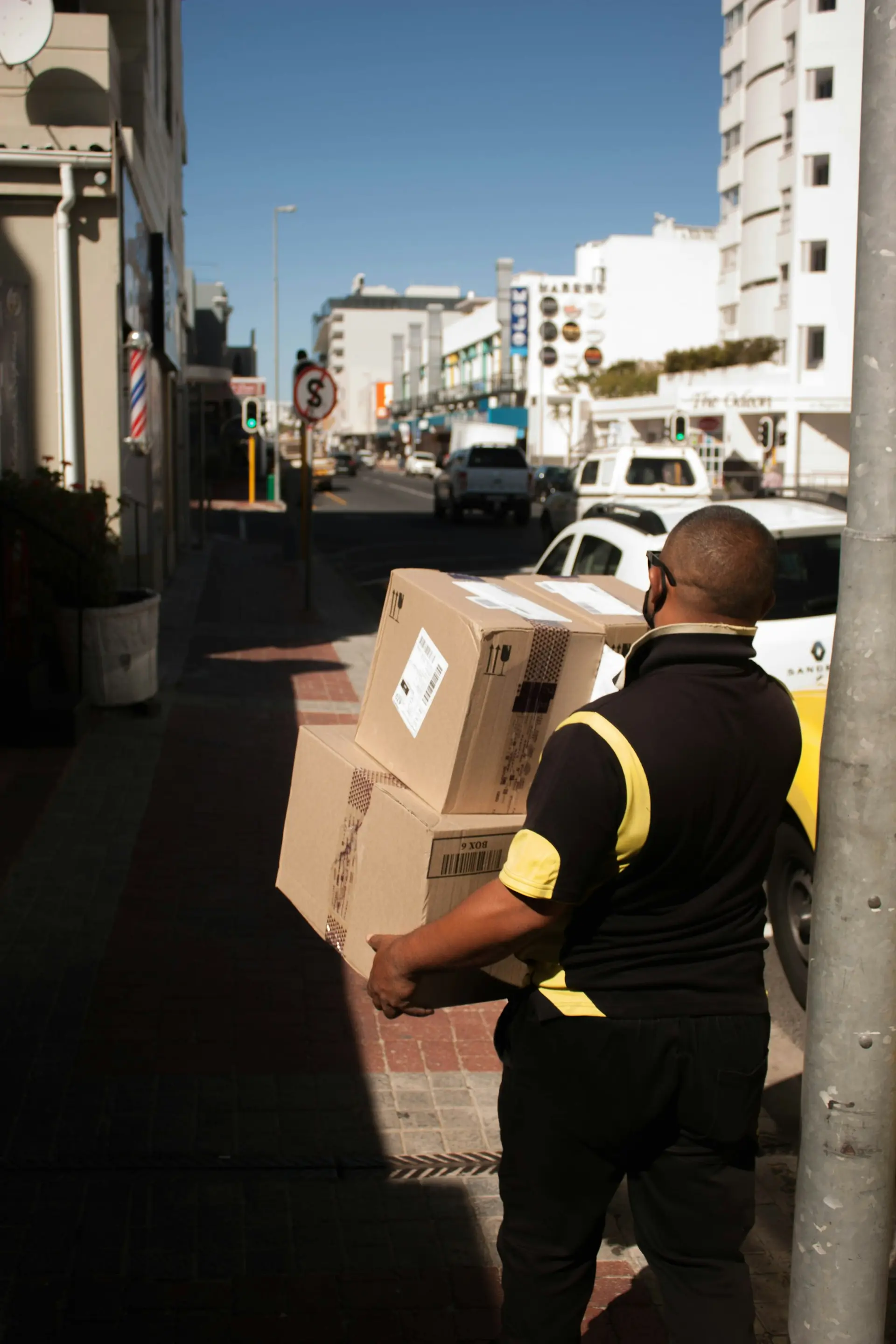 Man with a box on a city street