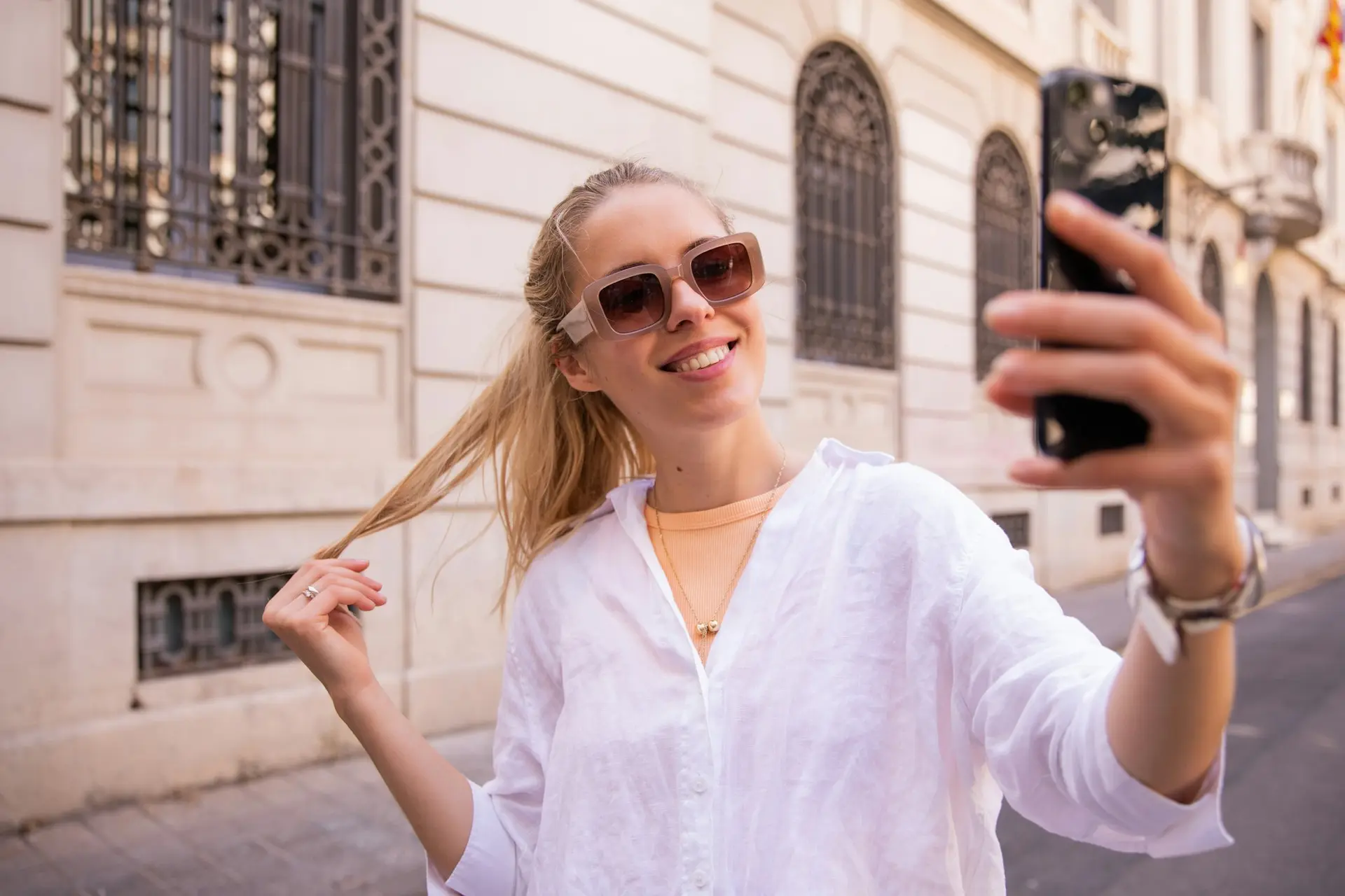 Woman taking a selfie with her phone