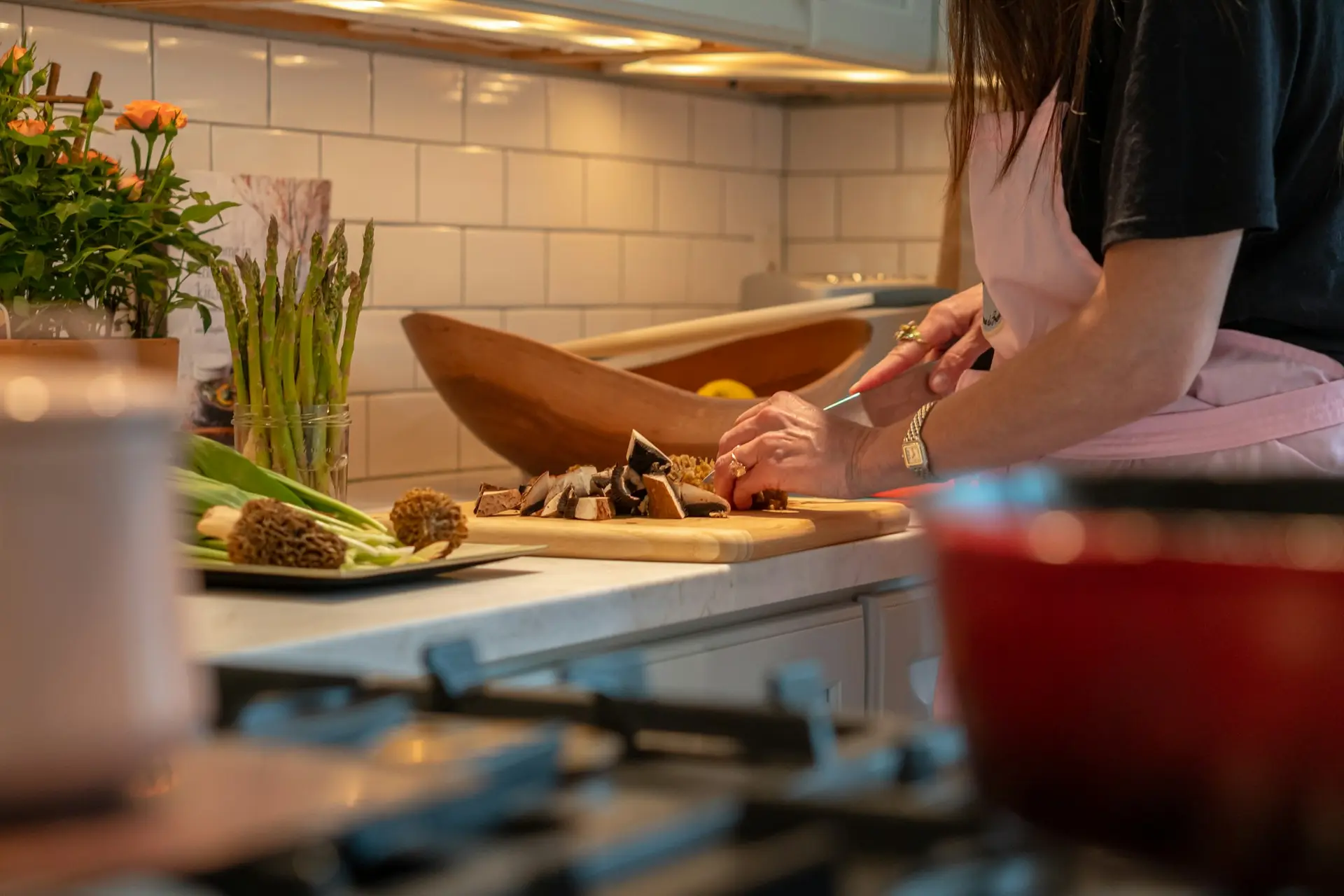 Woman chopping vegetables in a kitchen