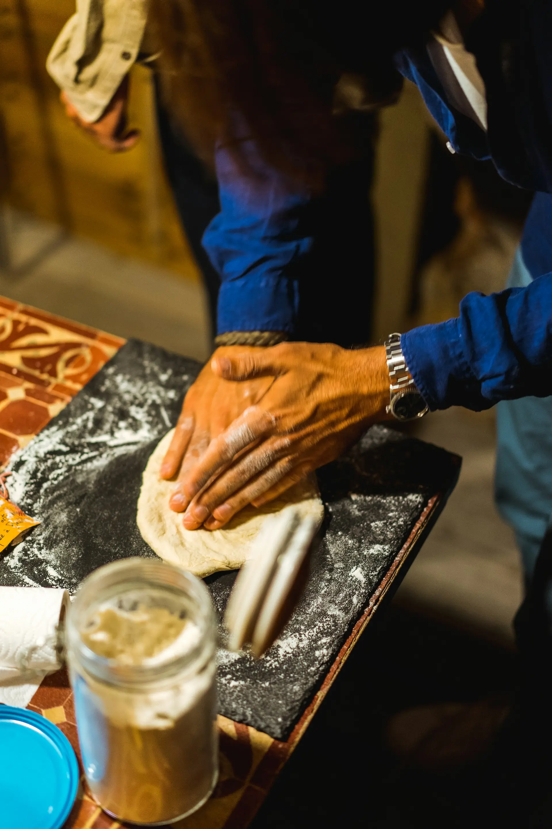 Person kneading bread
