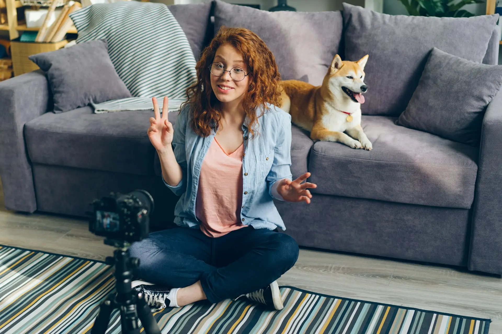 Woman sitting on the floor in front of a couch