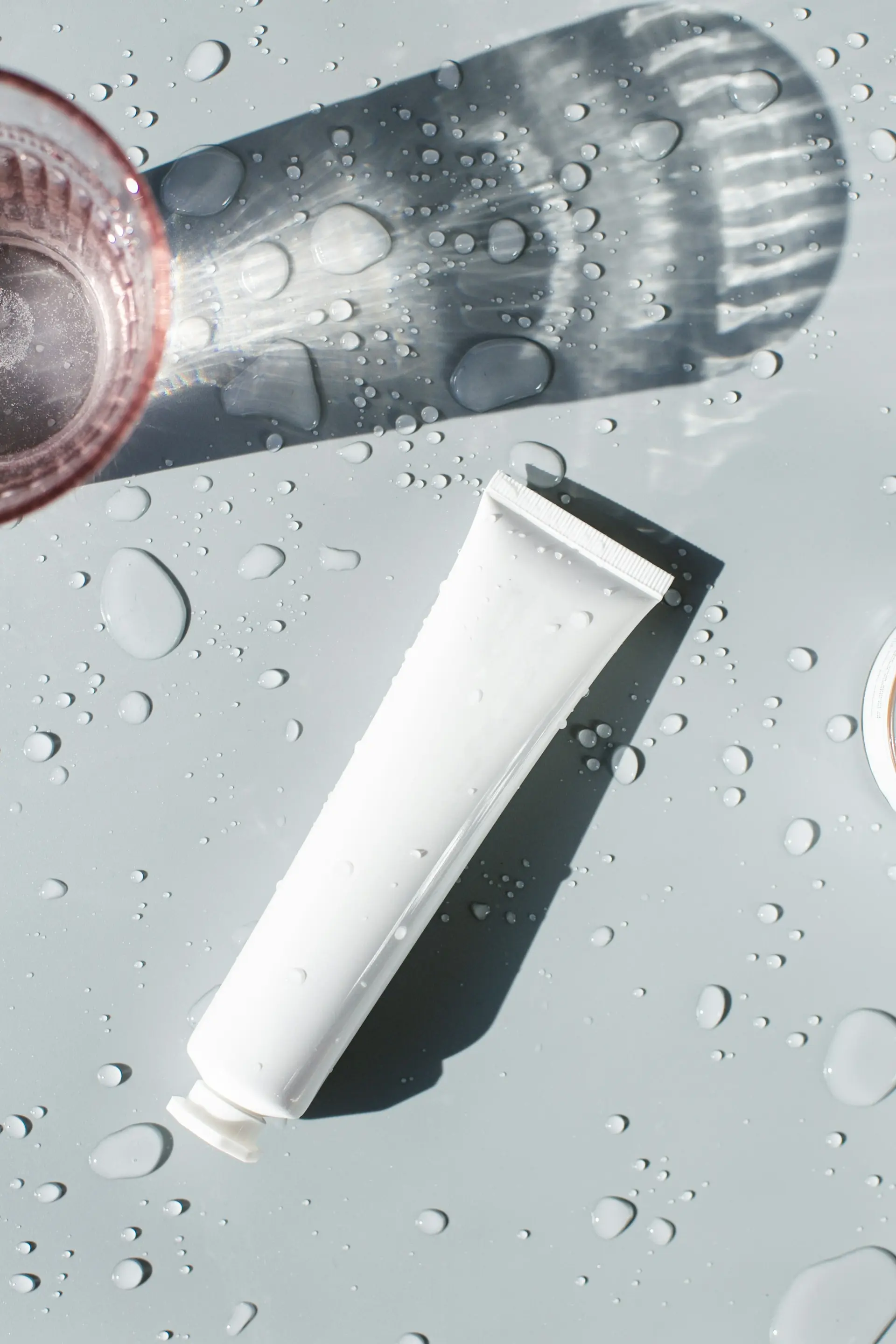 White tube on a glass table
